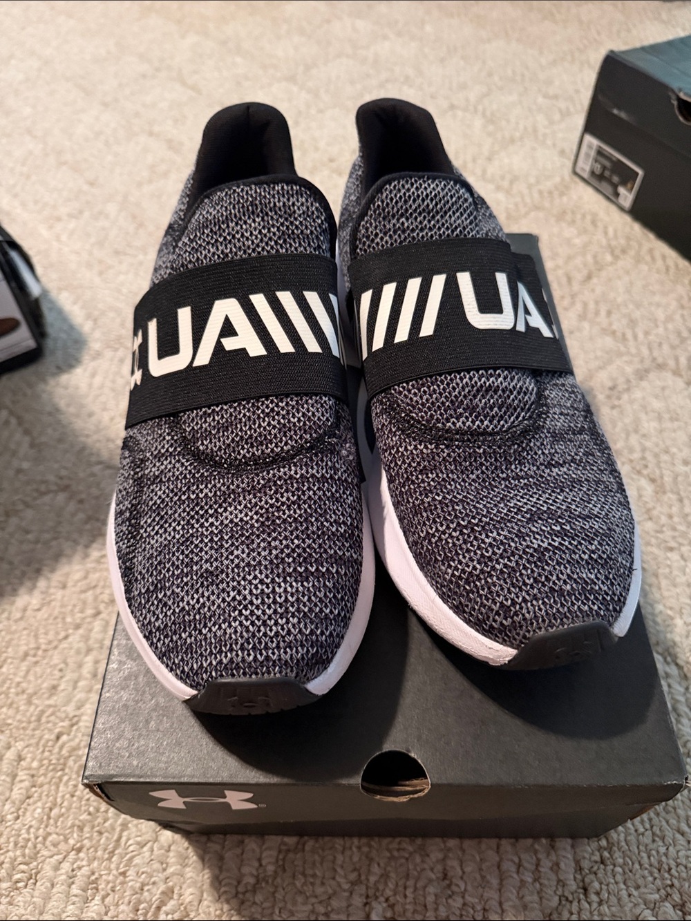Under Armour Men’sSlip-On Knit Sneakers in Black and White